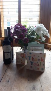 Flowers, wine and thank you cards